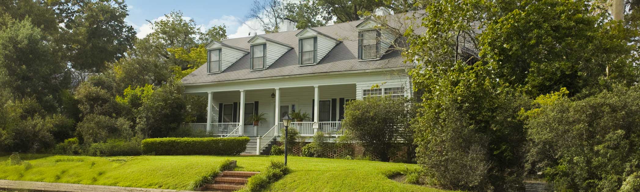 A beautiful historic home with a large porch