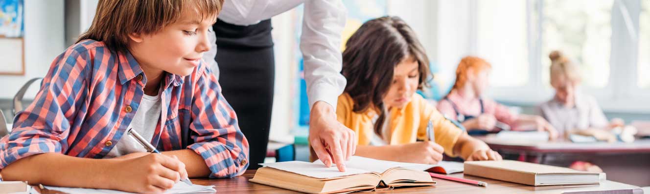 Elementary age children learning at school.