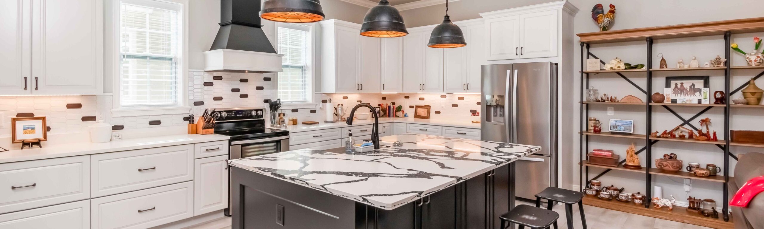 A stunning kitchen with pendant lighting and luxury center island.