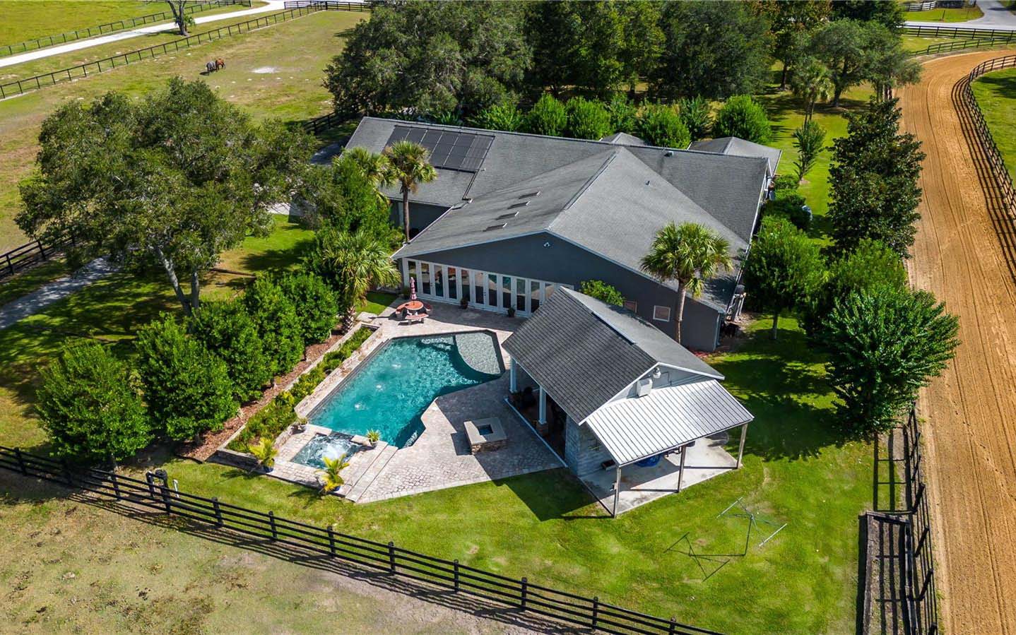 A beautiful home with mature landscaping and flowering shrubs.