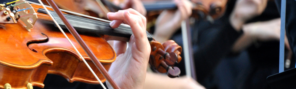 An orchestra practices for a symphony.