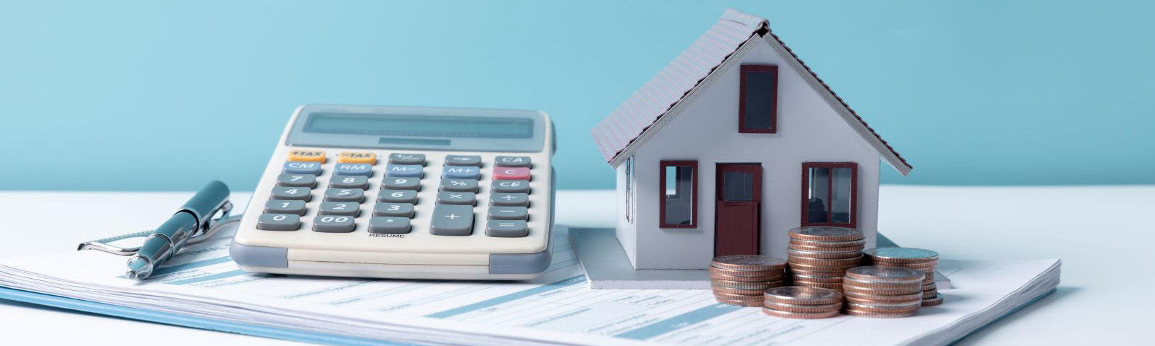 A calculator and a model of a house